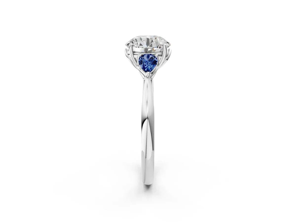 Round Cut Diamond Three-Stone Ring with Pear Blue Sapphire Side Stones and Prong Setting Silver
