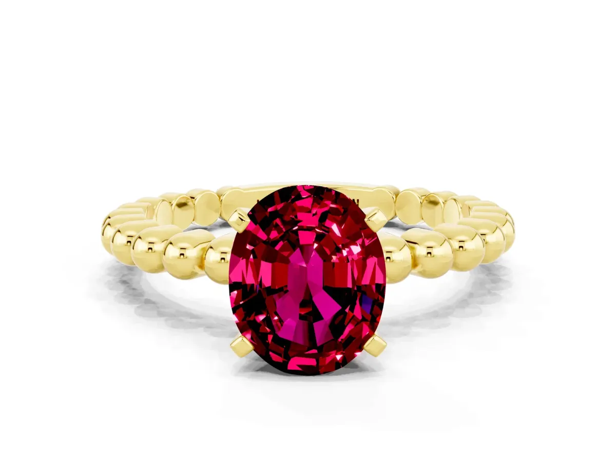 Oval Cut Garnet Solitaire Ring with Beaded Band and Prong Setting Yellow gold