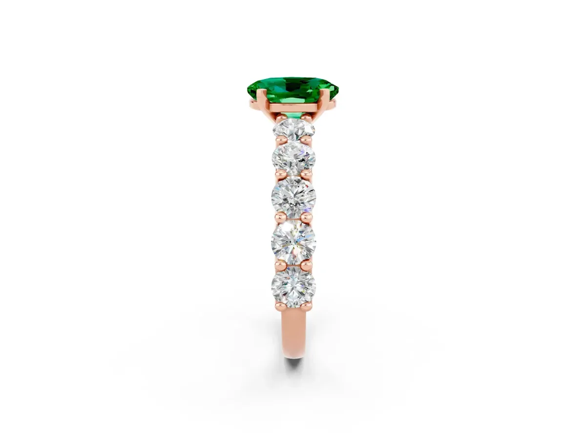 Oval Cut Emerald Prong Setting with Side Stones on a Pave Band Rose gold