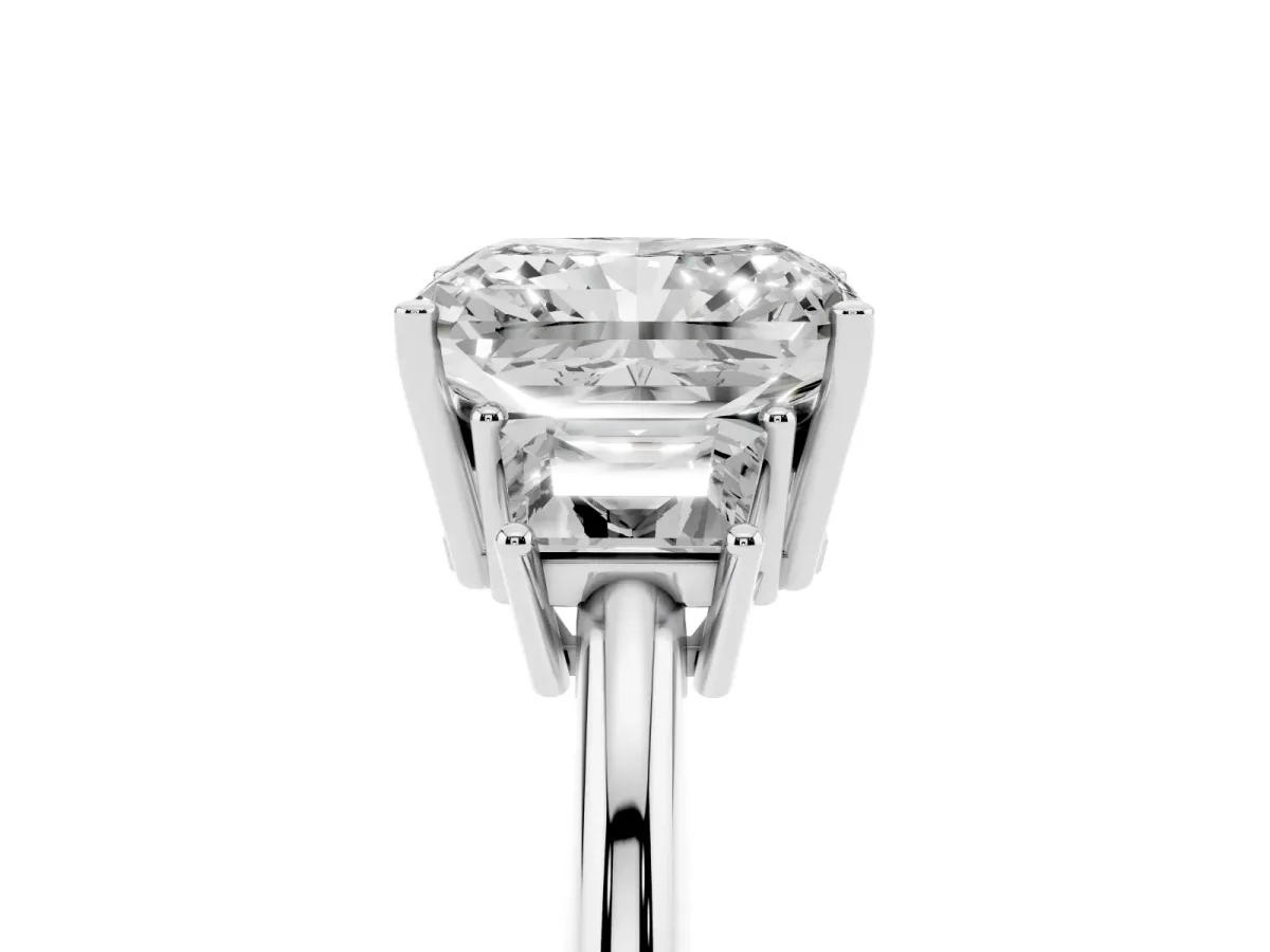 Radiant Cut Diamond Three-Stone Ring with Trapezoid Side Stones and Prong Setting Platinum