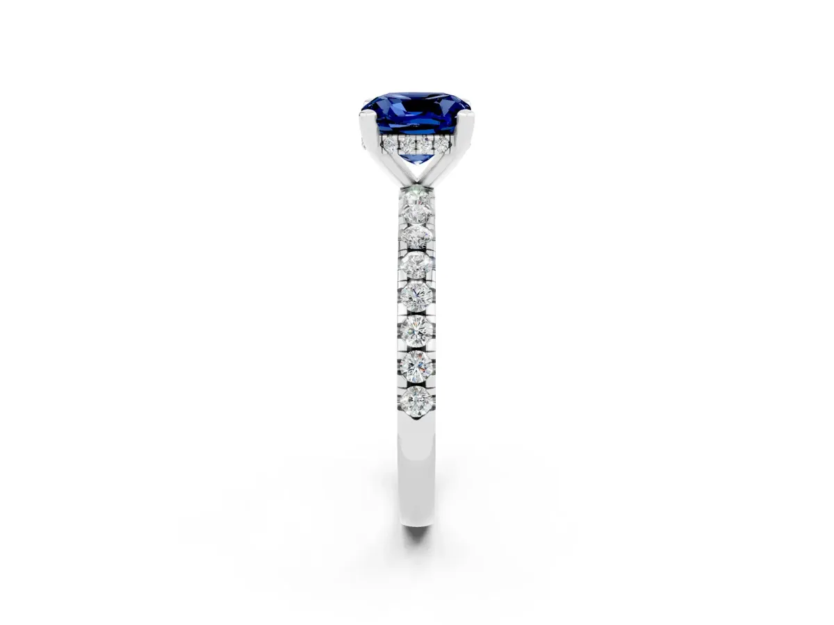 Cushion Cut Blue Sapphire Solitaire Ring with Round Pavé Band and Four-Prong Setting Silver