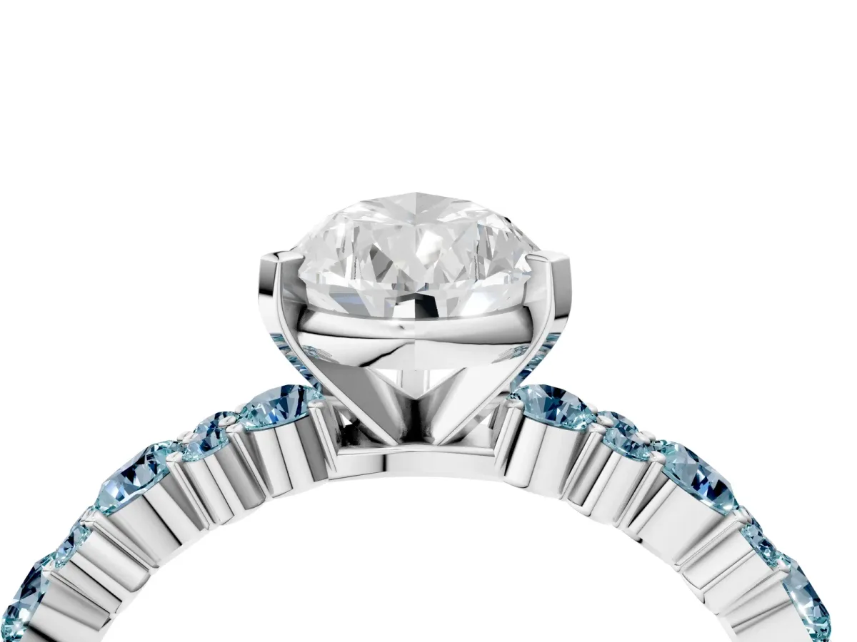 Pear Cut Diamond Side Stone Solitaire Ring with Round Aquamarine and Four-Prong Setting Silver