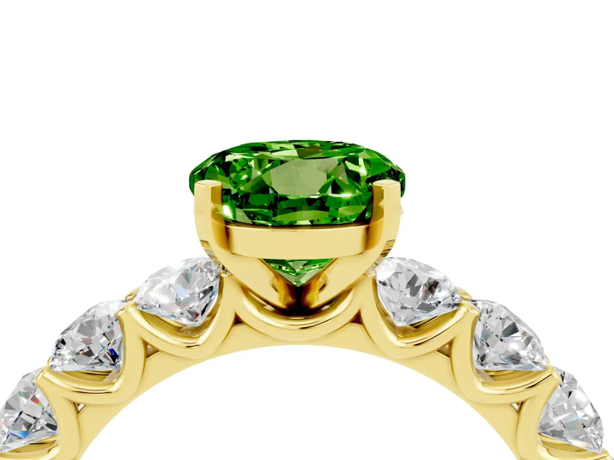 Round Cut Peridot Prong Setting with Side Stones on a Pave Band Yellow gold