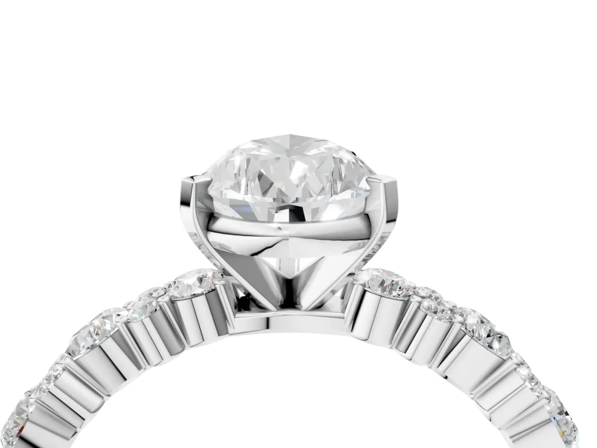 Pear Cut Diamond Side Stone Solitaire Ring with Round Moissanite and Four-Prong Setting White gold