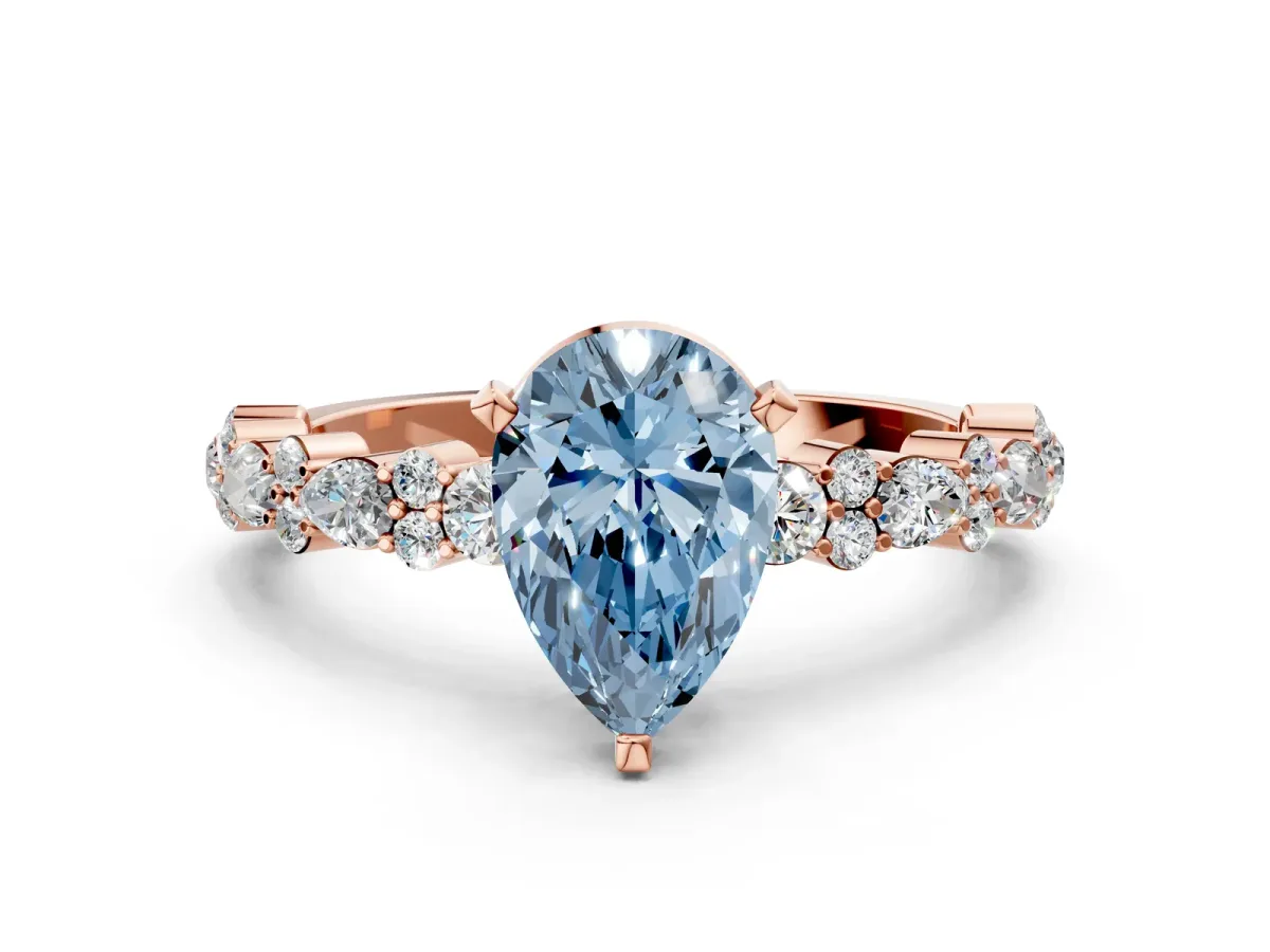 Fancy Blue Pear Cut Diamond Side Stone Solitaire Ring with Round and Four-Prong Setting Rose gold