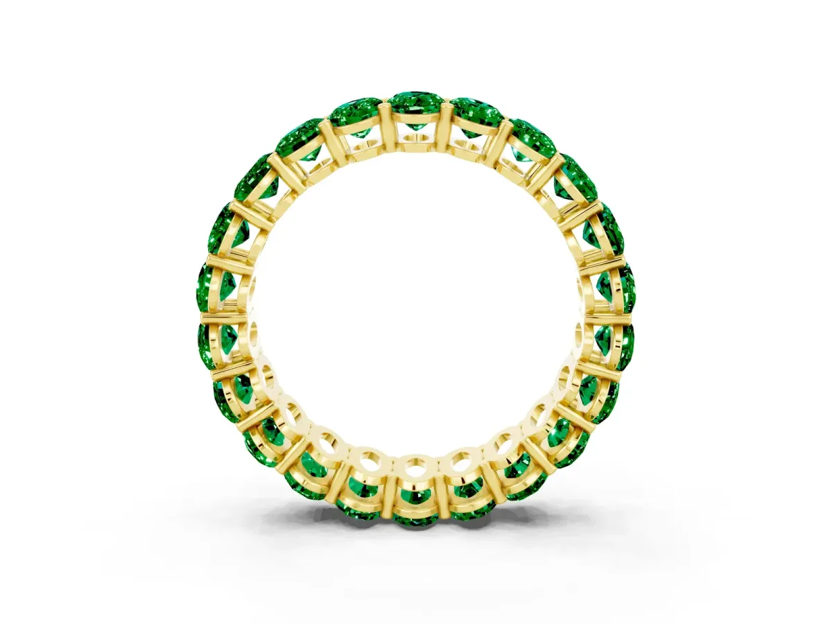Oval Cut Emerald Eternity Band with Shared Prong Setting Yellow gold