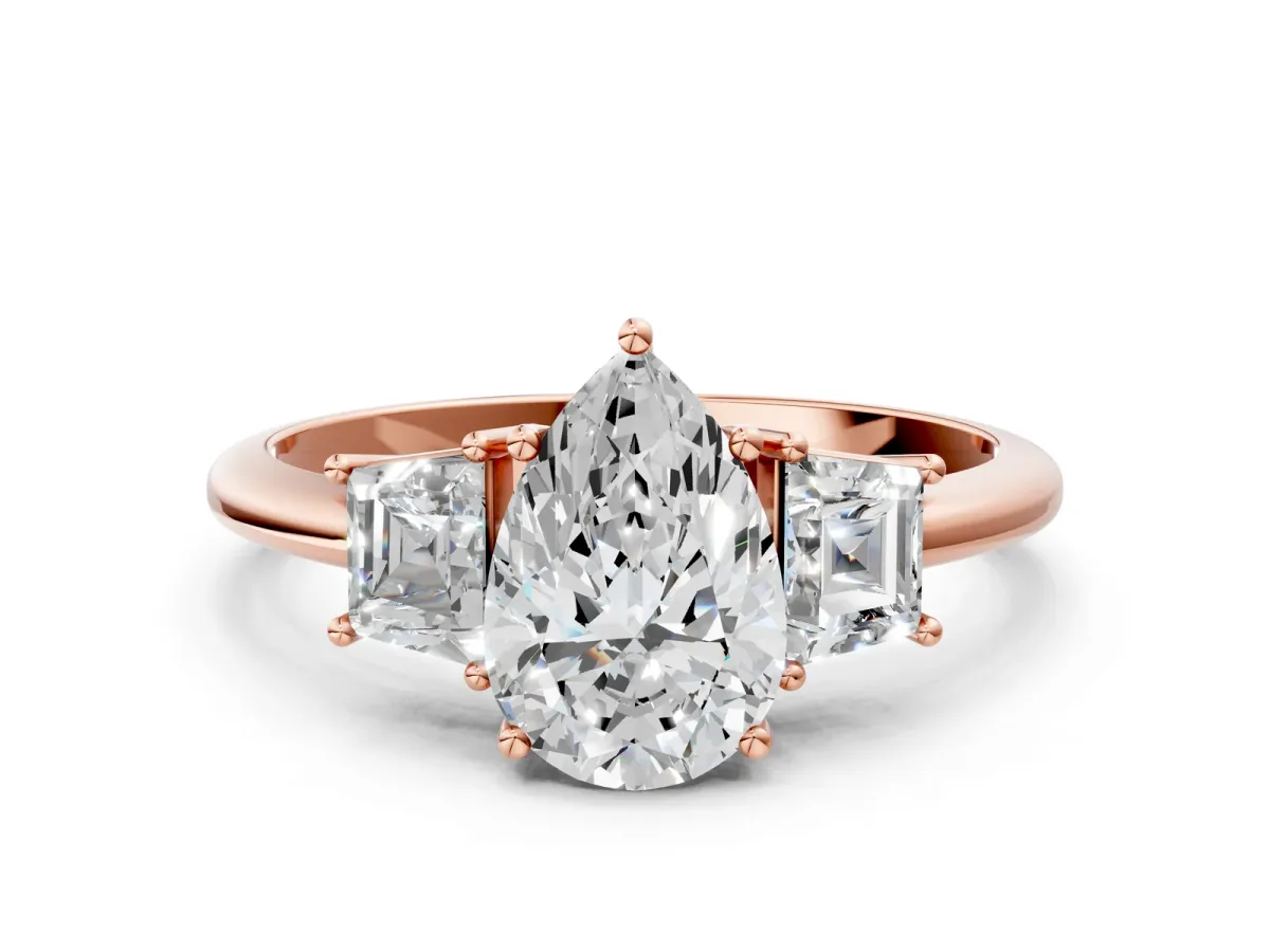 Pear Cut Diamond Three-Stone Ring with Trapezoid Side Stones and Prong Setting Rose gold