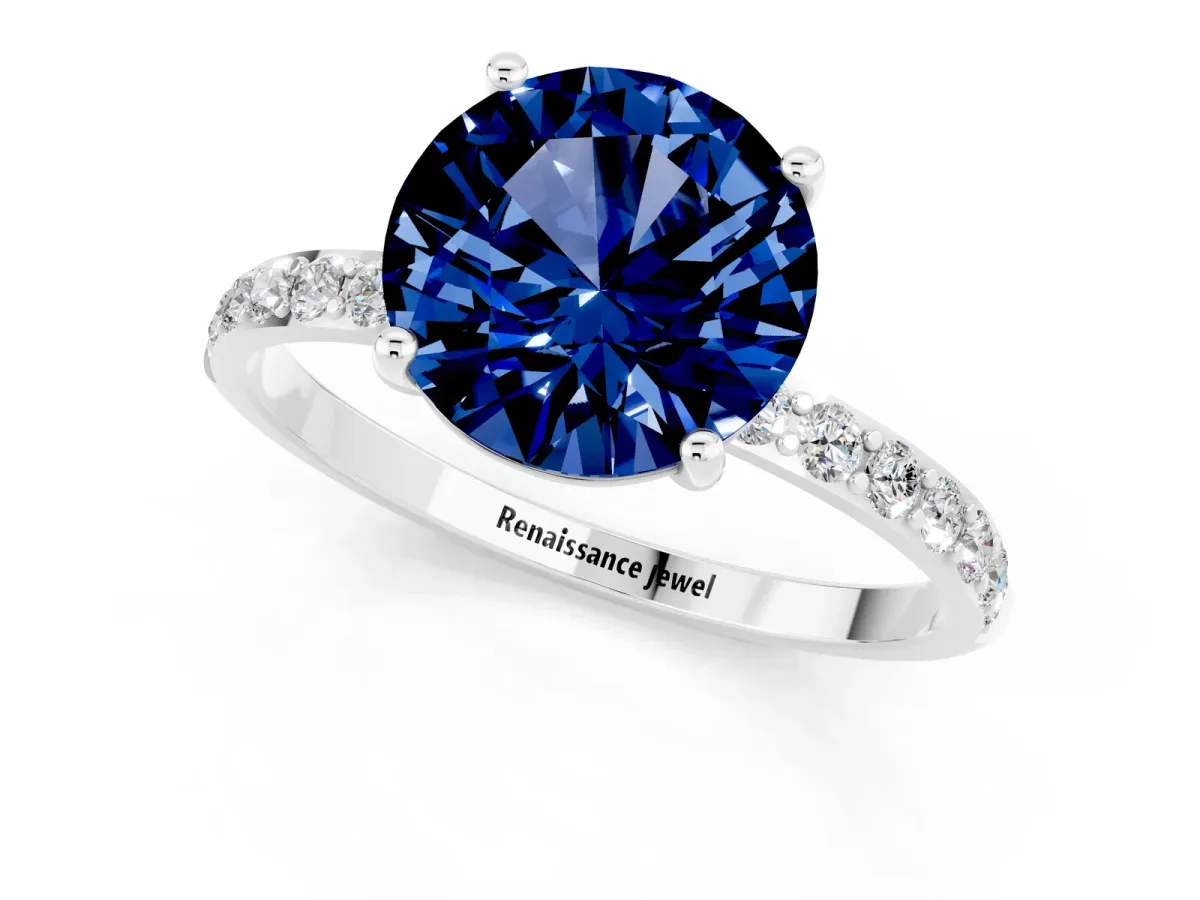 Round Cut Blue Sapphire Solitaire Ring with Round Pavé Band and Prong Setting Silver