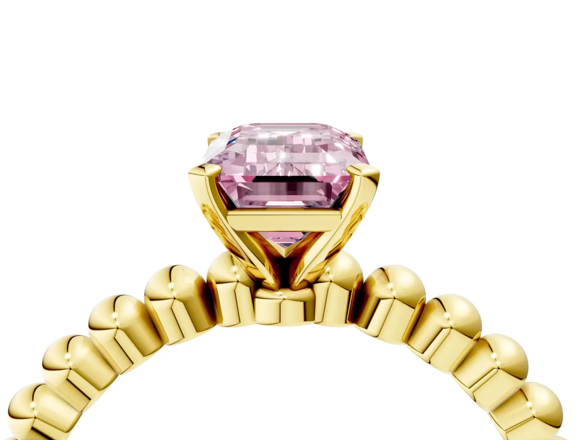 Fancy Pink Emerald Cut Diamond Solitaire Ring with Beaded Band and Prong Setting Yellow gold