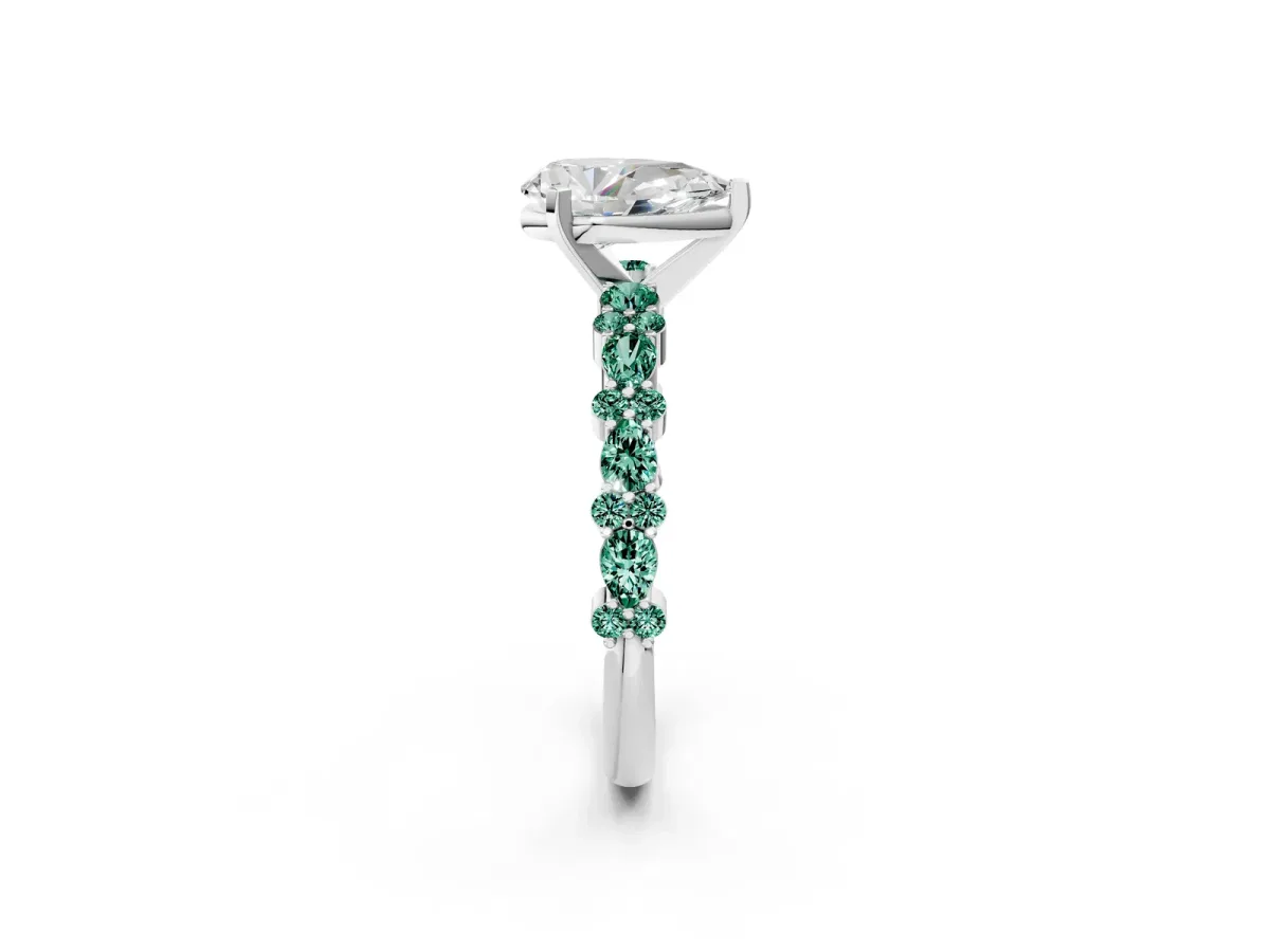 Pear Cut Diamond Side Stone Solitaire Ring with Round Green Sapphire and Four-Prong Setting Silver