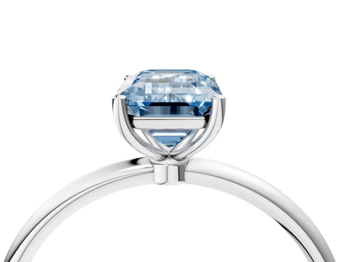 Fancy Blue Emerald Cut Cut Solitaire Engagement Ring with Thin Band and Four-Prong Setting Silver
