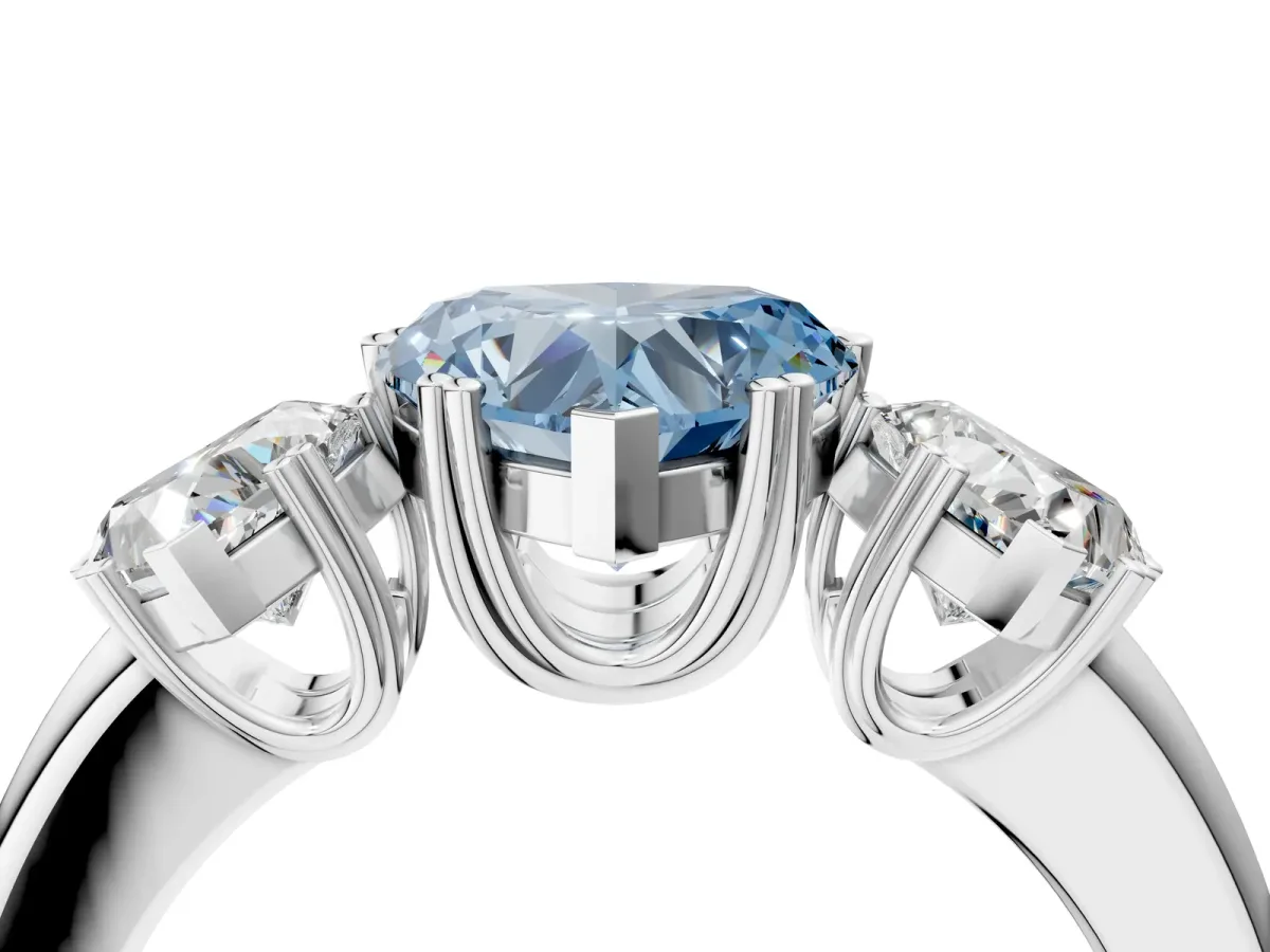 Fancy Blue Three-Stone Heart Cut Cut Diamond Ring with Channel Set Band and Four-Prong Setting Silver