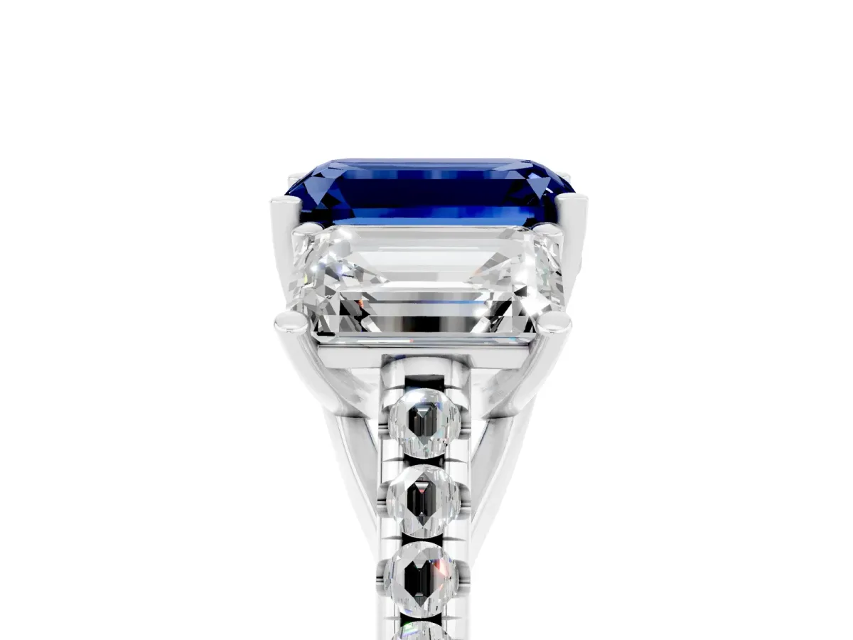 Three-Stone Emerald Cut Blue Sapphire Ring with Round Pavé Band and Prong Setting Platinum