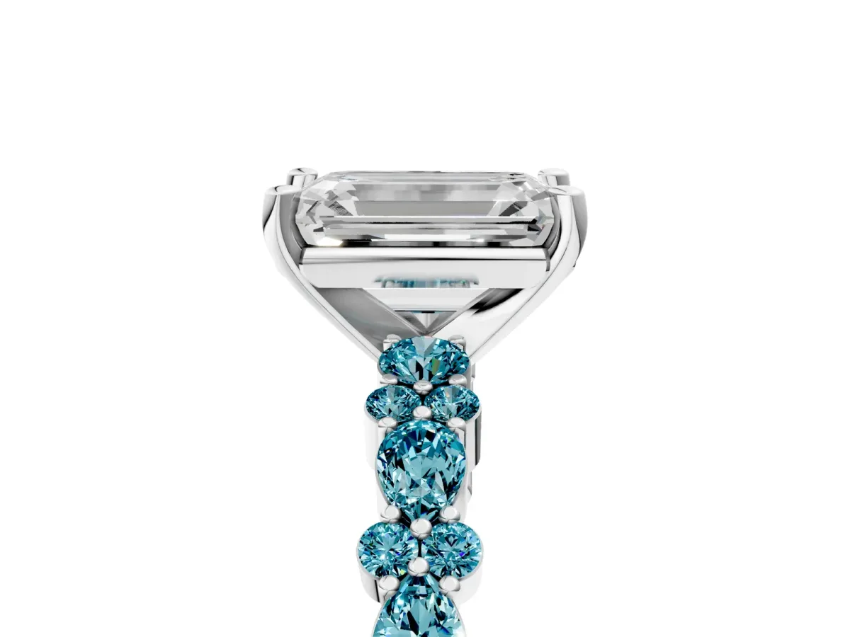 Emerald Cut Diamond Side Stone Solitaire Ring with Round Blue Topaz and Four-Prong Setting Platinum