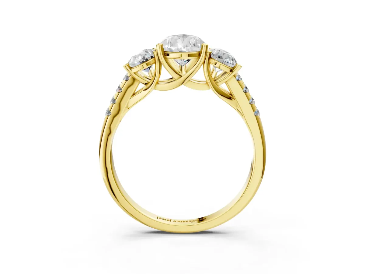 Three-Stone Pear Cut Diamond Ring with Round Pavé Band and Prong Setting Yellow gold