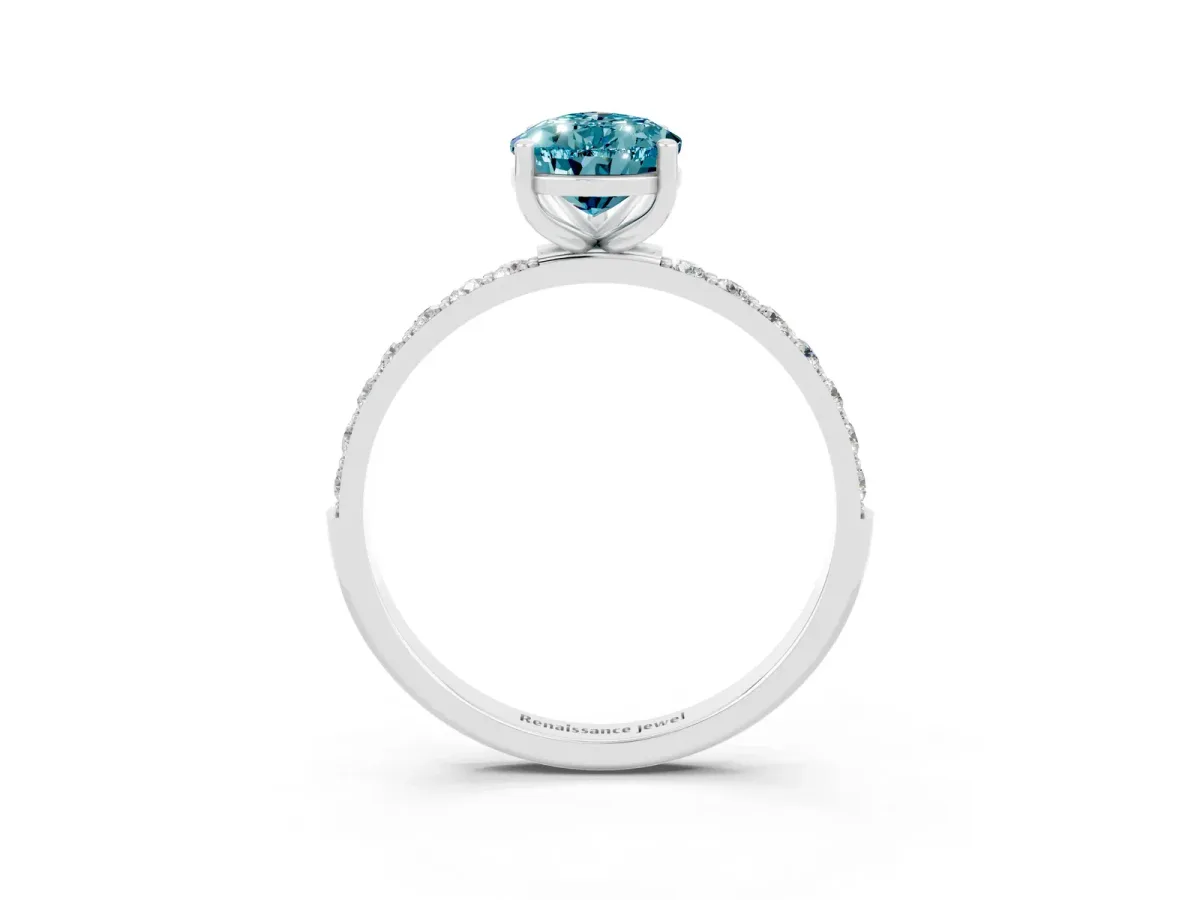 Pear Cut Blue Topaz Solitaire Ring with Round Pavé Band and Prong Setting Silver
