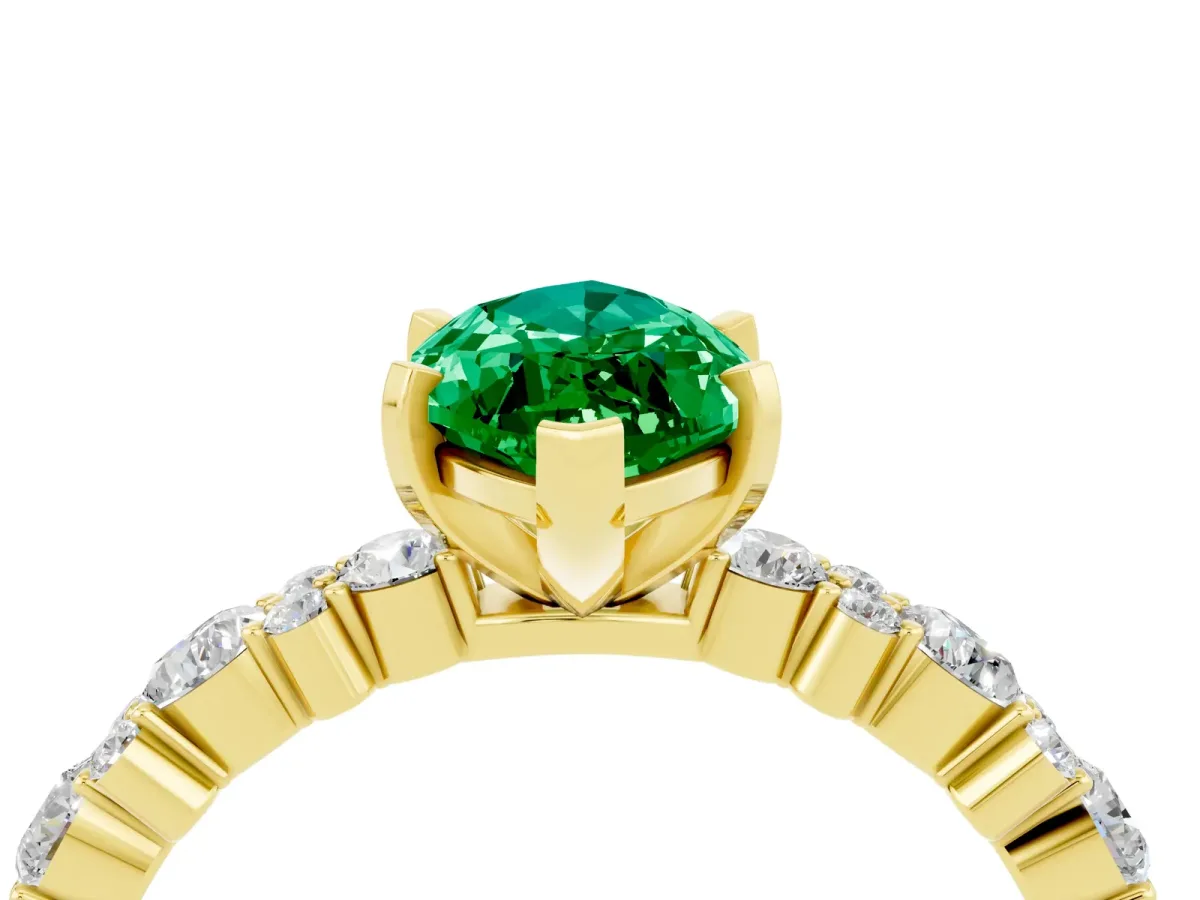 Marquise Cut Emerald Side Stone Solitaire Ring with Round and Four-Prong Setting Yellow gold