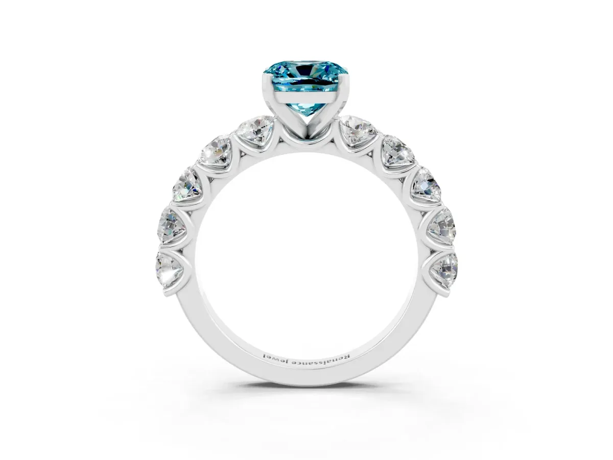 Cushion Cut Blue Topaz Prong Setting with Side Stones on a Pave Band Silver