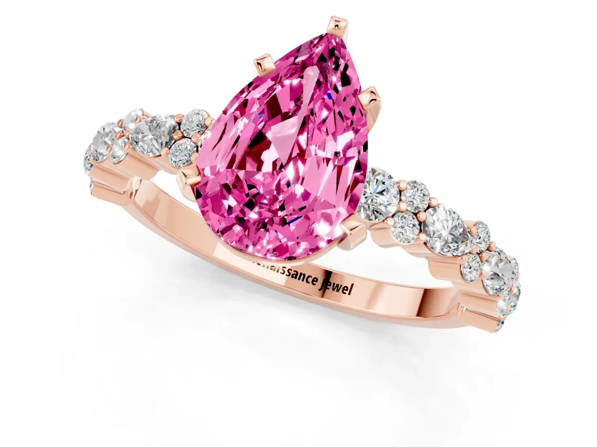 Pear Cut Pink Sapphire Side Stone Solitaire Ring with Round and Four-Prong Setting Rose gold