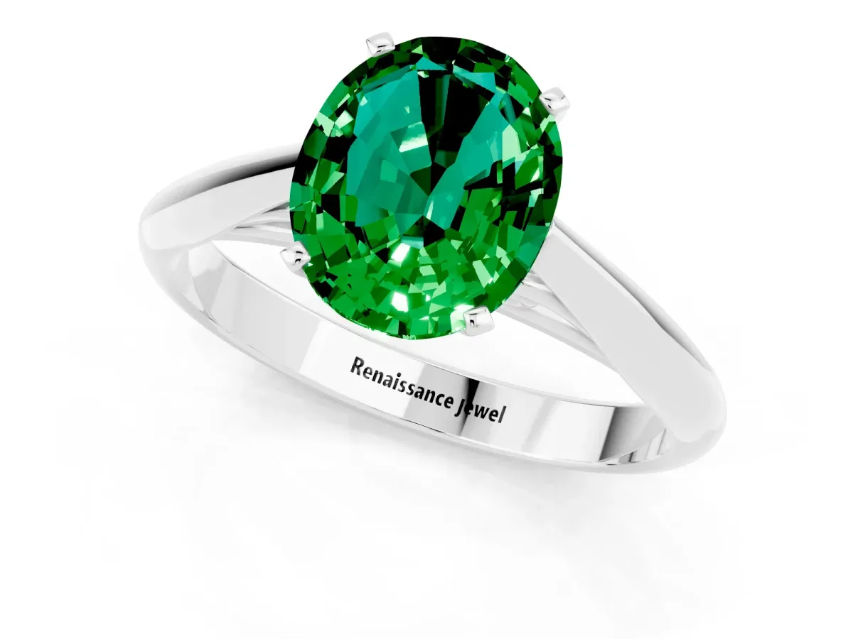 Oval Cut Emerald Solitaire Engagement Ring with Cathedral Setting and Four-Prong Mount White gold