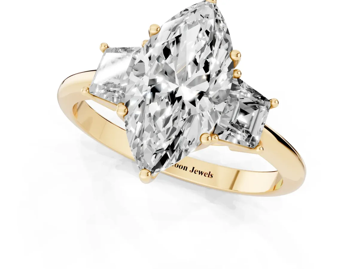 Marquise Cut Diamond Three-Stone Ring with Trapezoid Side Stones and Prong Setting Yellow gold