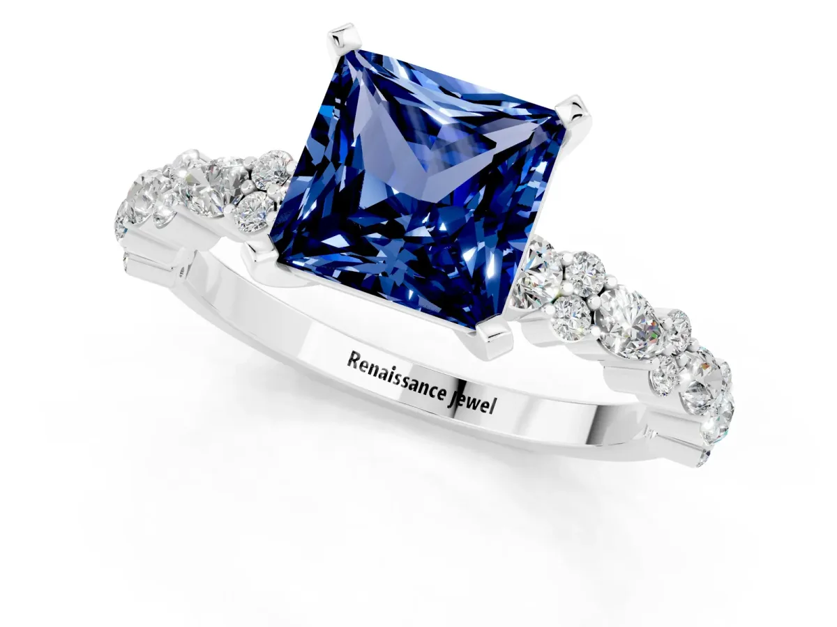 Princess Cut Blue Sapphire Side Stone Solitaire Ring with Round and Four-Prong Setting Platinum