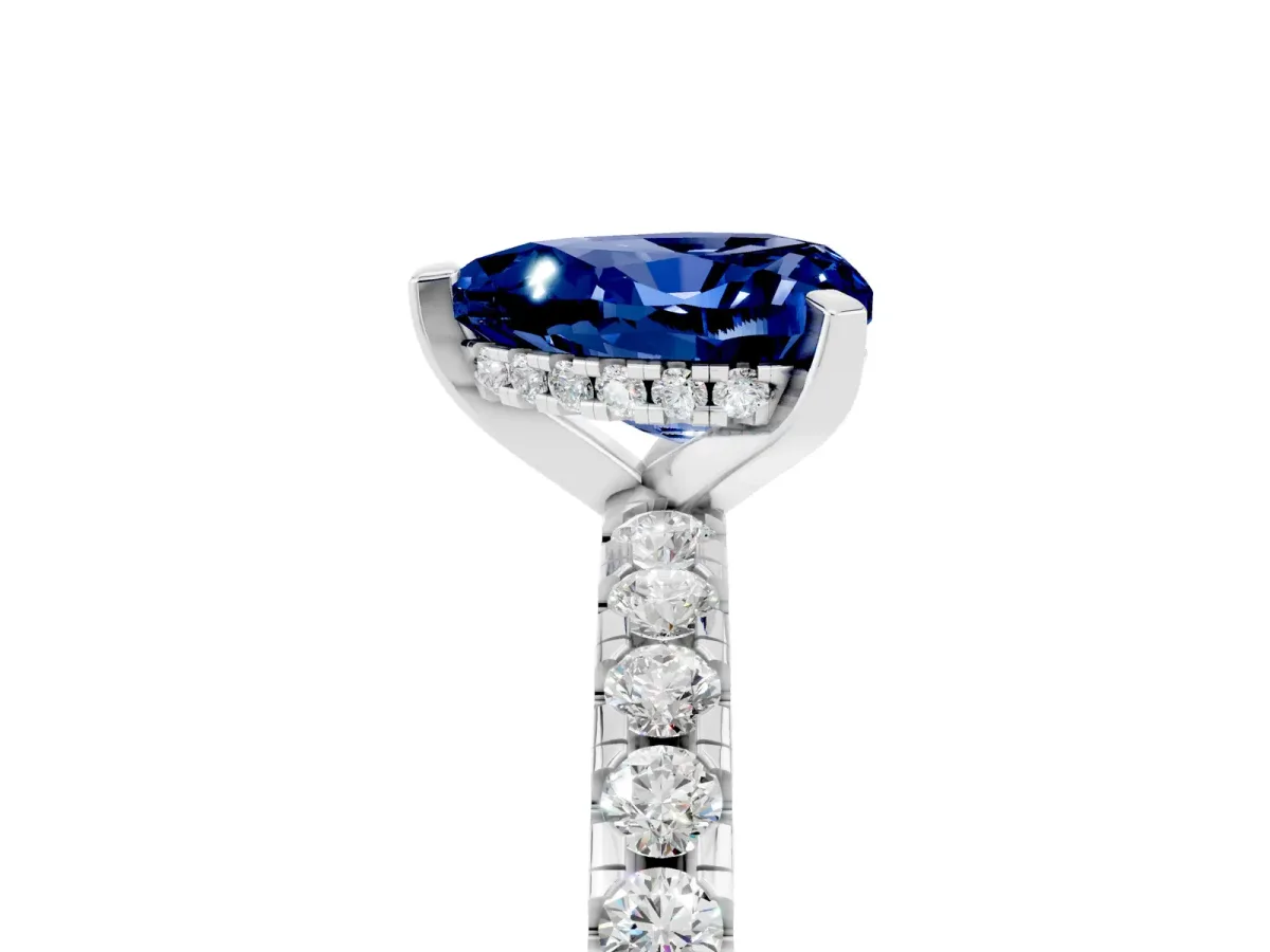 Heart Cut Blue Sapphire Solitaire Ring with Round Pavé Band and Four-Prong Setting Silver