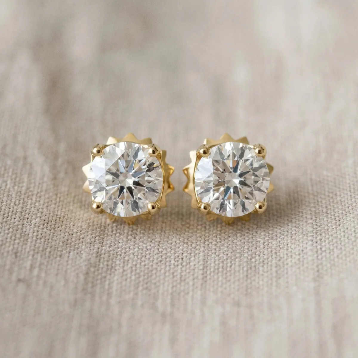 Round Solitaire Diamond Stud Earrings with Four-Prong Basket Setting Yellow gold