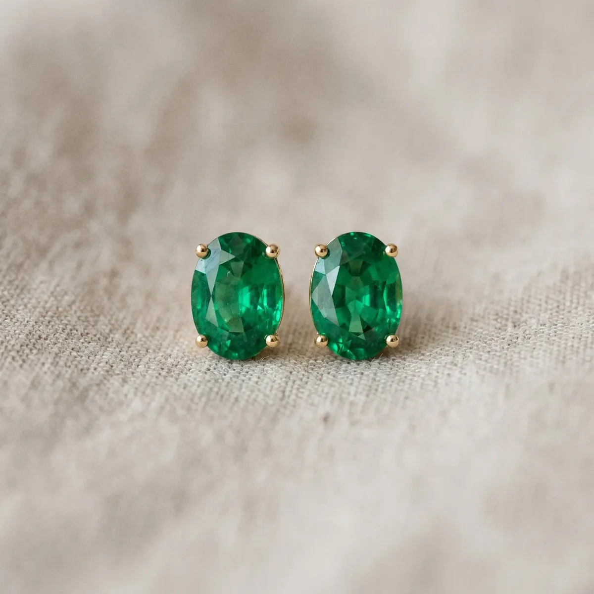 Oval Cut Emerald Stud Earrings Yellow gold
