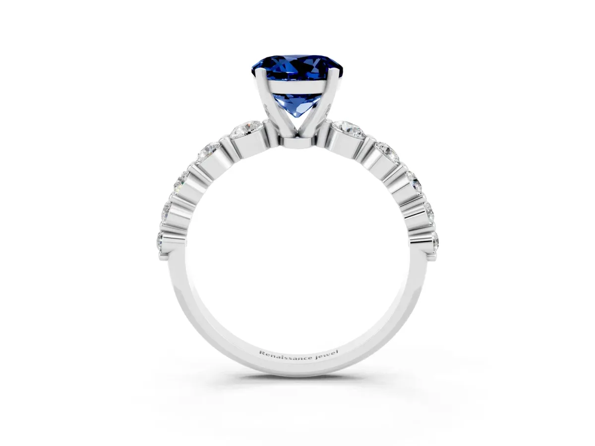Round Cut Solitaire Blue Sapphire Ring with Pave Band and Four-Prong Setting Silver