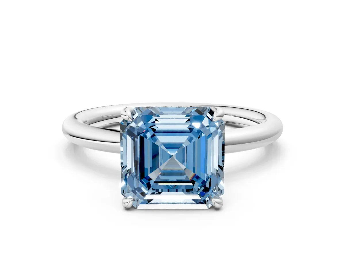 Fancy Blue Asscher Cut Diamond Solitaire Ring with Thin Band and Four-Prong Setting Platinum