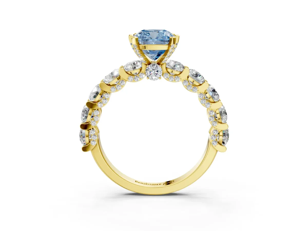 Fancy Blue Cushion Cut Diamond Side Stone Engagement Ring with Four-Prong Setting Yellow gold