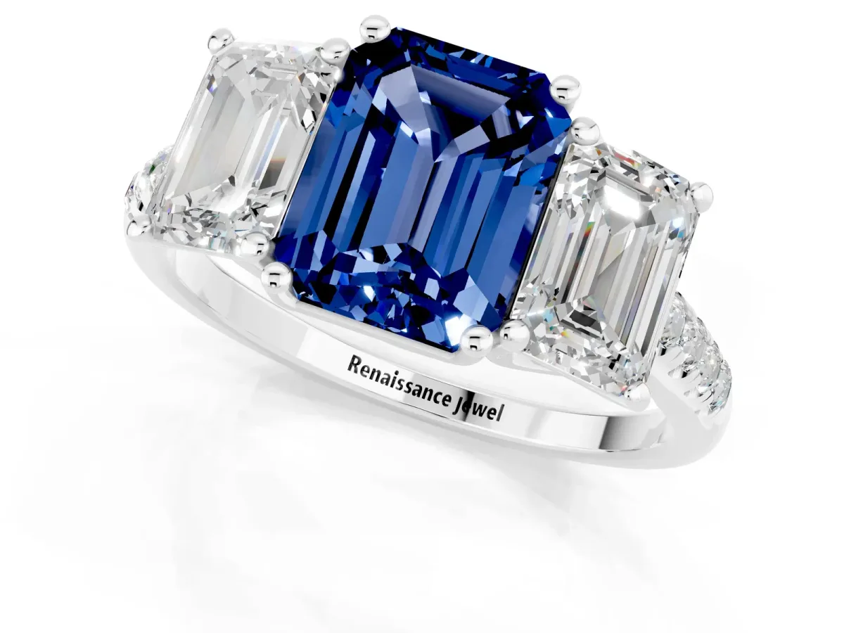 Three-Stone Emerald Cut Blue Sapphire Ring with Round Pavé Band and Prong Setting Platinum