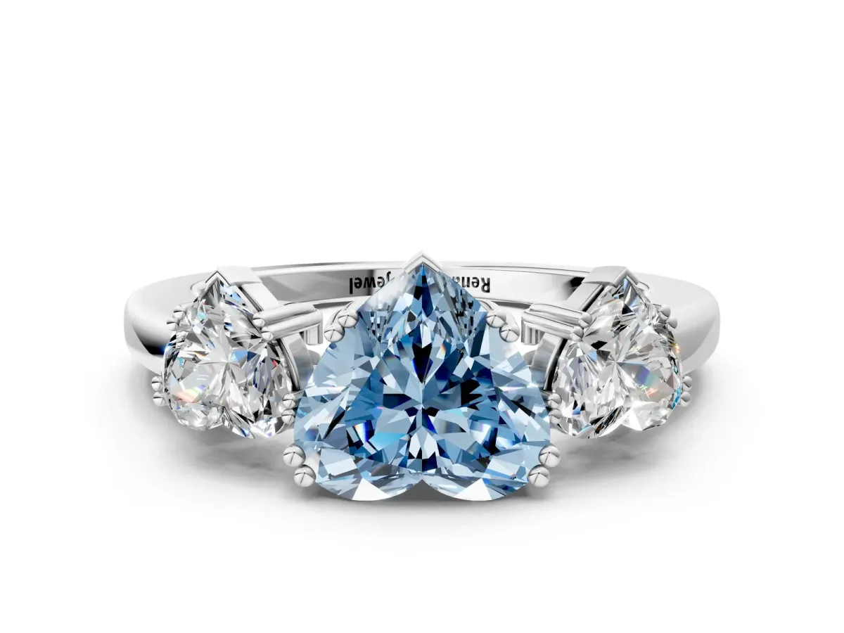 Fancy Blue Three-Stone Heart Cut Cut Diamond Ring with Channel Set Band and Four-Prong Setting Silver