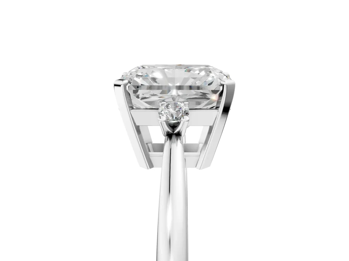 Radiant Cut Cut Three-Stone Solitaire Ring with Round Accent Diamonds and Four-Prong Setting Platinum