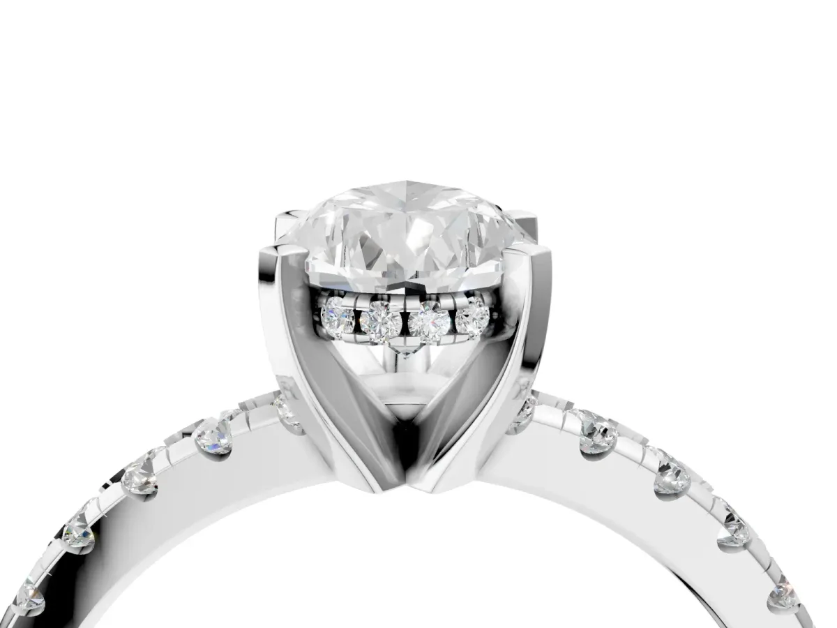 Pear Cut Diamond Solitaire Ring with Round Pavé Band and Four-Prong Setting Platinum