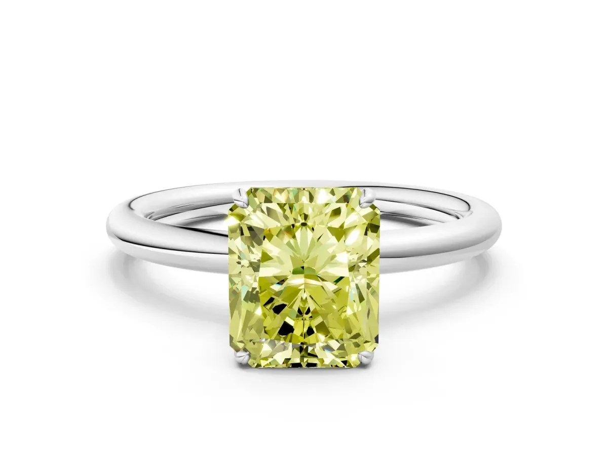 Fancy Yellow Radiant Cut Solitaire Diamond Ring with Four-Prong Setting on a Plain Band Platinum