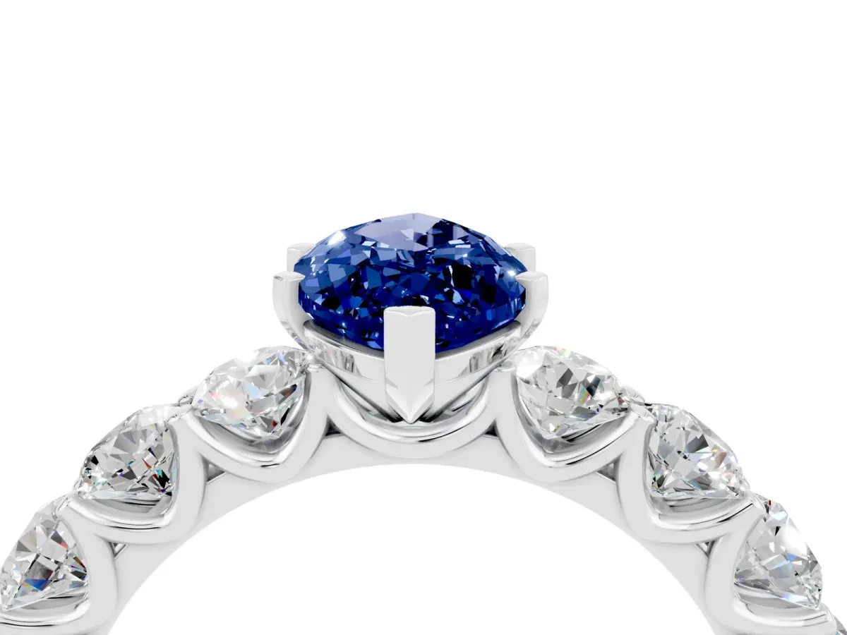 Marquise Cut Blue Sapphire Prong Setting with Side Stones on a Pave Band Silver