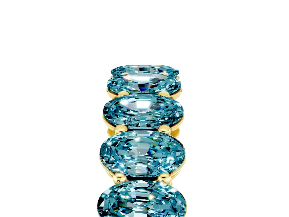 Oval Cut Blue Topaz Eternity Band with Shared Prong Setting Yellow gold