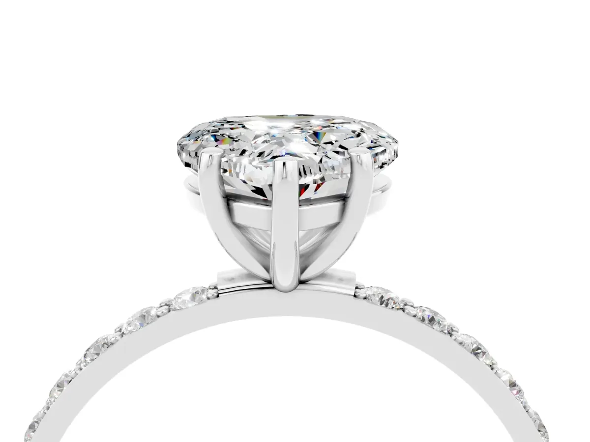 Heart Cut Moissanite Solitaire Ring with Round Pavé Band and Prong Setting Silver