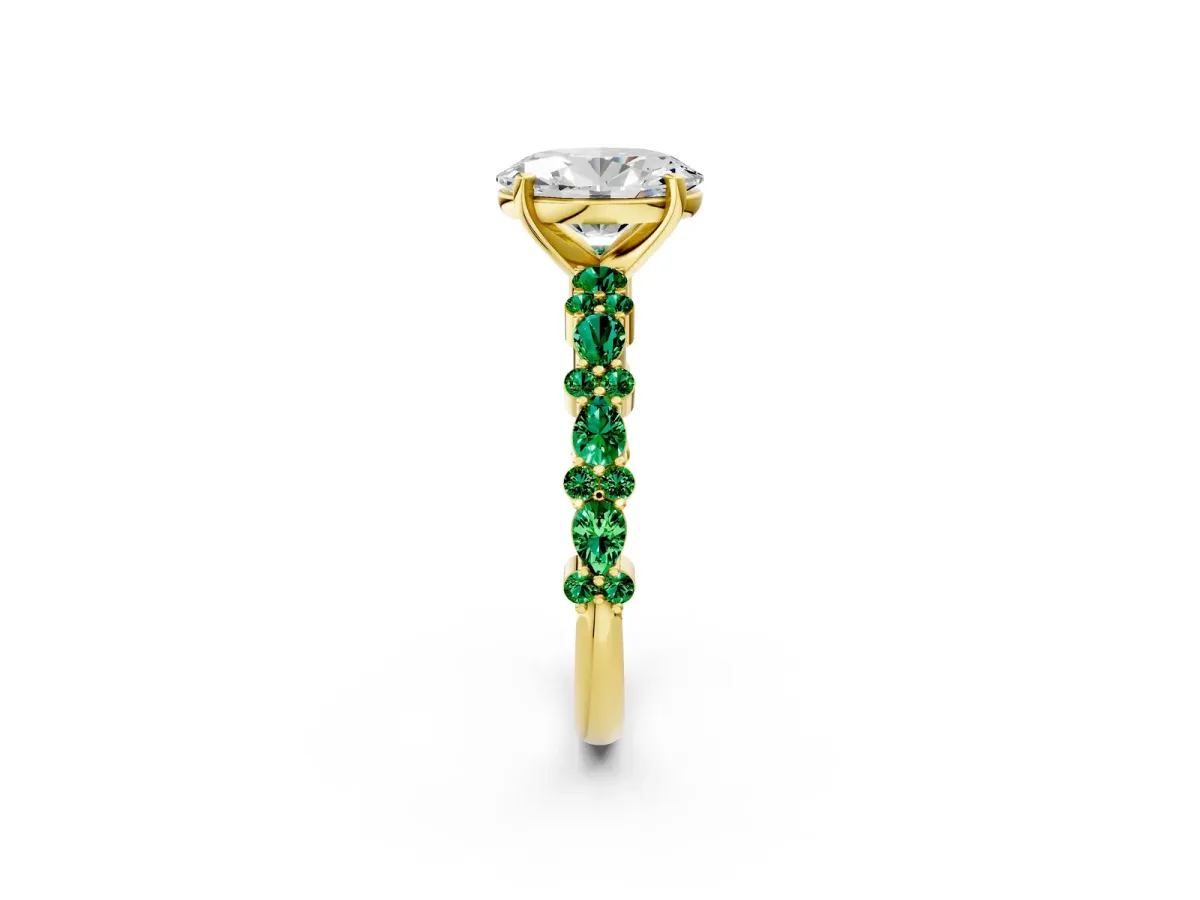 Oval Cut Diamond Side Stone Solitaire Ring with Round Emerald and Four-Prong Setting Yellow gold