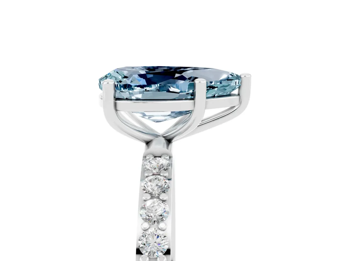 Pear Cut Aquamarine Solitaire Ring with Round Pavé Band and Prong Setting Silver