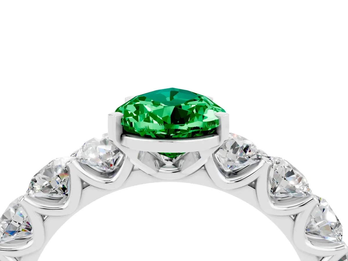 Pear Cut Emerald Prong Setting with Side Stones on a Pave Band White gold