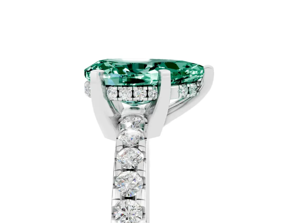 Pear Cut Green Sapphire Solitaire Ring with Round Pavé Band and Four-Prong Setting Silver