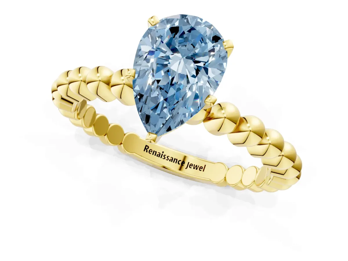 Fancy Blue Pear Cut Diamond Solitaire Ring with Beaded Band and Prong Setting Yellow gold