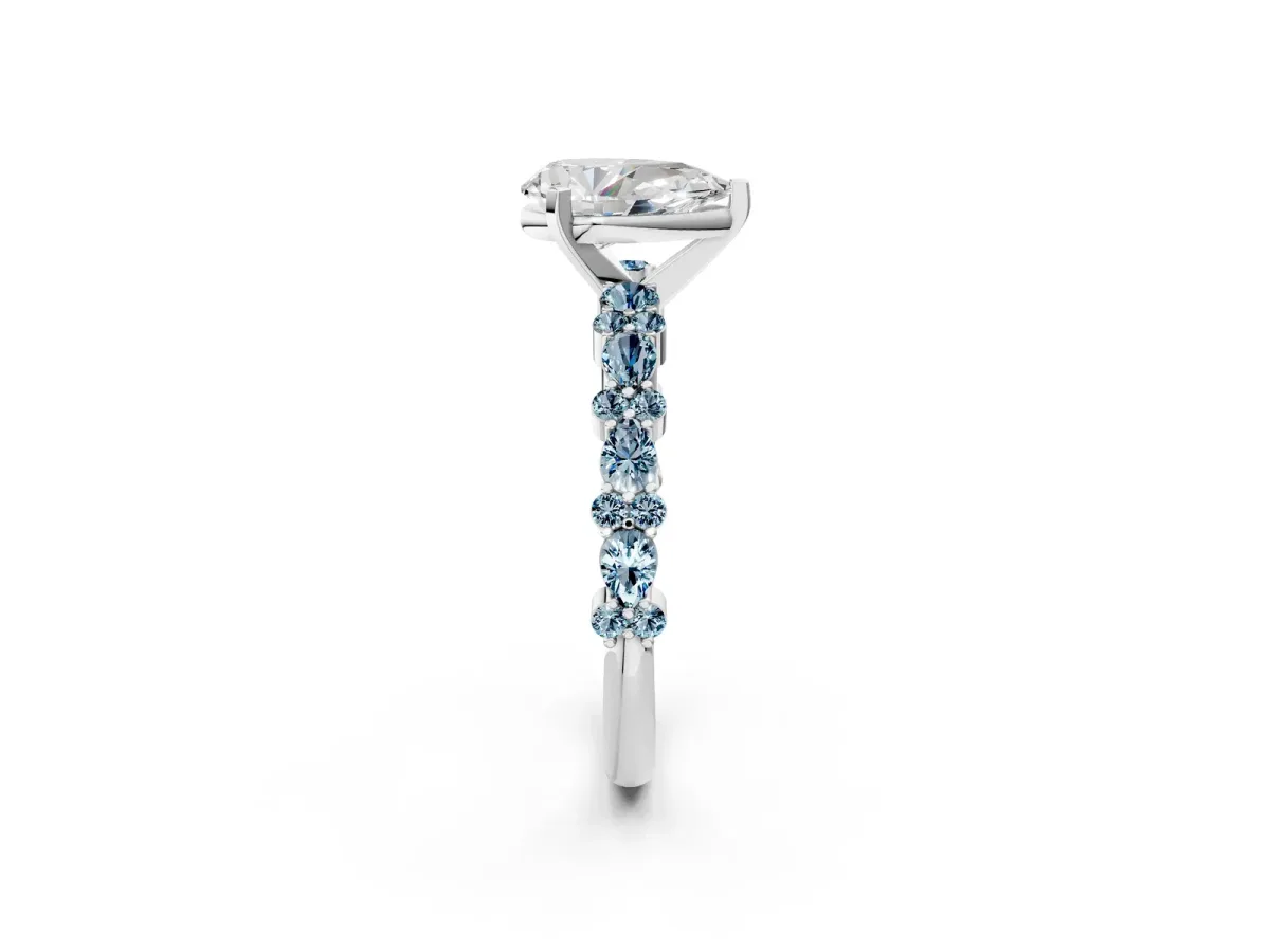 Pear Cut Diamond Side Stone Solitaire Ring with Round Aquamarine and Four-Prong Setting Silver