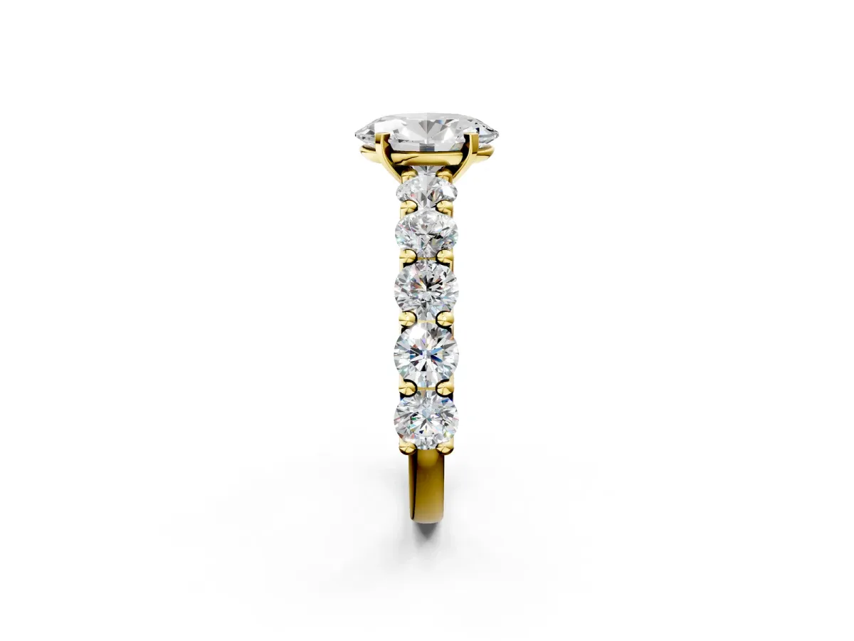 Oval Cut Diamond Prong Setting with Side Stones on a Pave Band Yellow gold