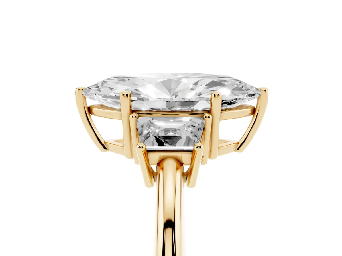 Marquise Cut Diamond Three-Stone Ring with Trapezoid Side Stones and Prong Setting Yellow gold