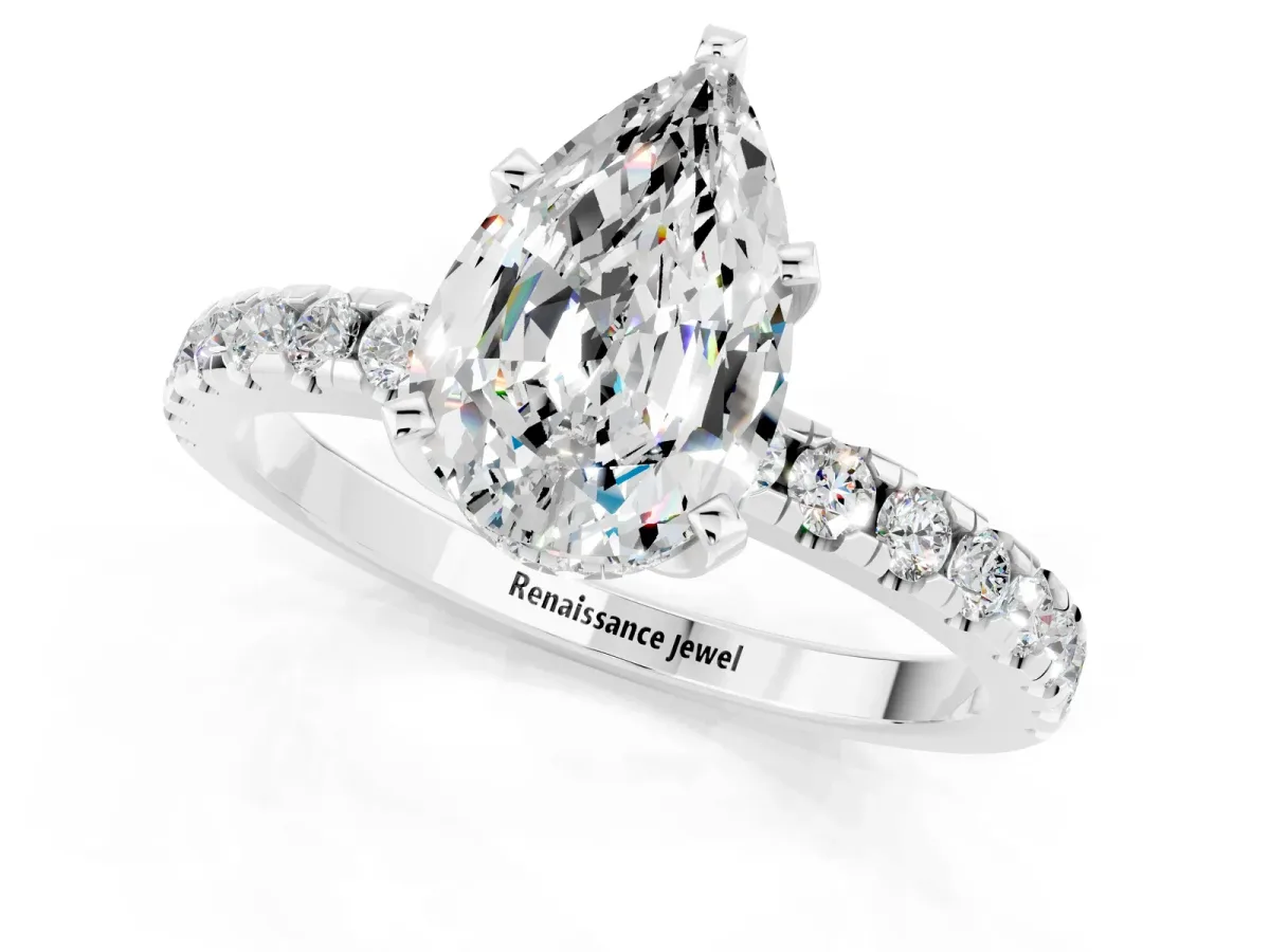Pear Cut Moissanite Solitaire Ring with Round Pavé Band and Four-Prong Setting Silver