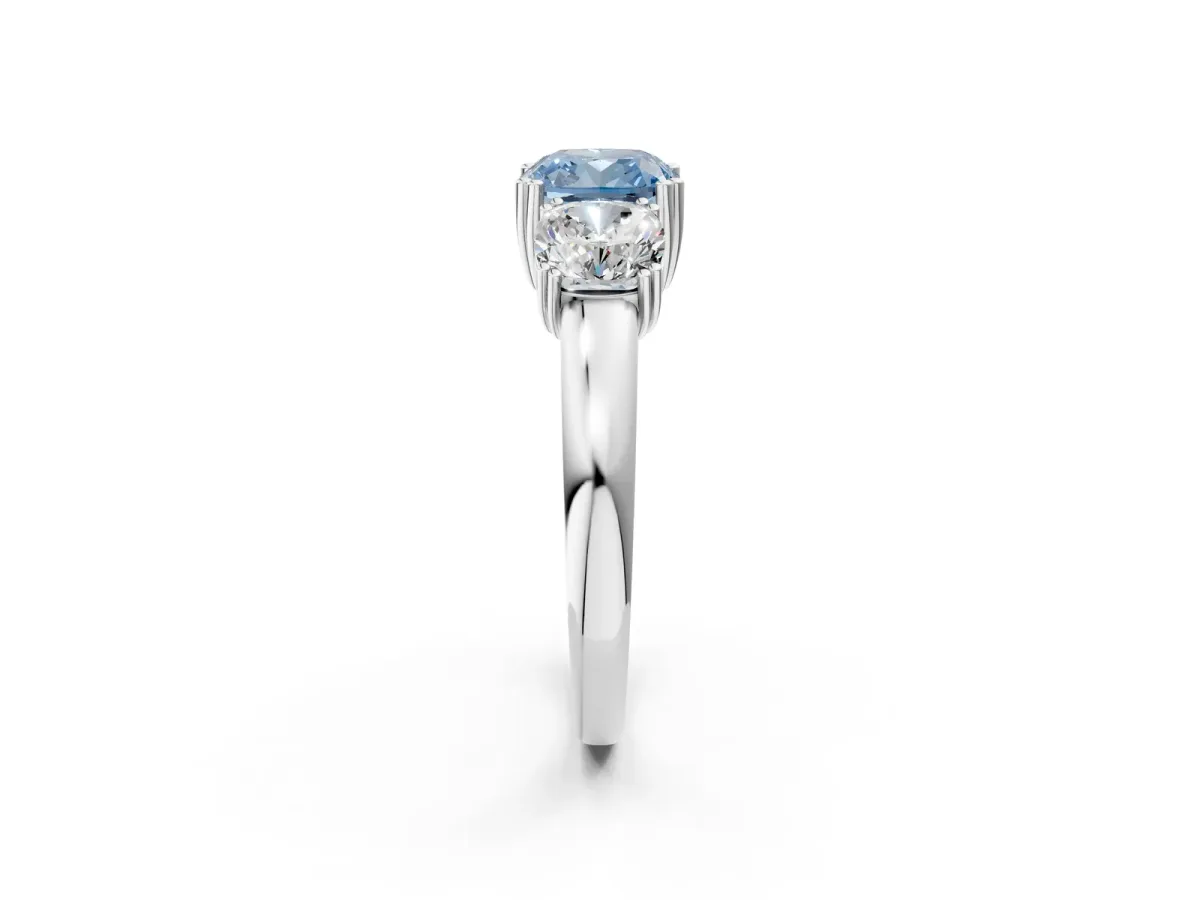 Fancy Blue Three-Stone Cushion Cut Cut Diamond Ring with Channel Set Band and Four-Prong Setting Silver